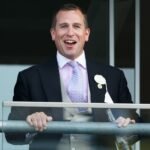 peter-phillips-watches-the-racing-as-he-attends-day